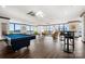 Spacious game room featuring a pool table, ping pong, and comfortable lounge area with city views at 222 S Caldwell St # 1803, Charlotte, NC 28202