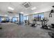 Well-equipped gym with cardio machines, weights, and scenic city views from large windows at 222 S Caldwell St # 1803, Charlotte, NC 28202