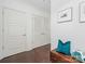 Inviting condo hallway with hardwood floors, white trim, and stylish decor at 222 S Caldwell St # 1803, Charlotte, NC 28202