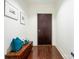 Hallway with dark wood floors, a rustic wooden chest and minimal decor at 222 S Caldwell St # 1803, Charlotte, NC 28202