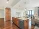 Open concept kitchen with granite countertops, stainless appliances and seamless flow to the living area at 222 S Caldwell St # 1803, Charlotte, NC 28202