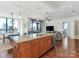 Open kitchen with granite countertops, wooden cabinets, and modern appliances at 222 S Caldwell St # 1803, Charlotte, NC 28202