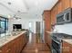 Modern kitchen features stainless steel appliances, granite countertops, and hardwood flooring at 222 S Caldwell St # 1803, Charlotte, NC 28202