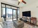 Open living room with sliding doors to balcony and stunning city views at 222 S Caldwell St # 1803, Charlotte, NC 28202