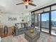 Inviting living room with balcony access, open to the kitchen and dining areas at 222 S Caldwell St # 1803, Charlotte, NC 28202