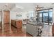 Spacious living room and adjacent kitchen with city views from the balcony at 222 S Caldwell St # 1803, Charlotte, NC 28202