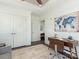 Cozy home office with a wooden desk, rolling chair, and stylish decor on a patterned rug at 222 S Caldwell St # 1803, Charlotte, NC 28202