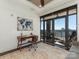 Office with modern desk, balcony, and stunning city views at 222 S Caldwell St # 1803, Charlotte, NC 28202