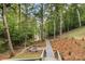 Picturesque backyard with a fire pit and scenic lake view, perfect for outdoor relaxation and entertaining at 231 Sunny Path Ln, Statesville, NC 28677