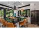 Open kitchen with granite counters, seating, stainless steel appliances, and forest views at 231 Sunny Path Ln, Statesville, NC 28677