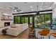 Open living space concept with kitchen island, and floor to ceiling windows looking into forest at 231 Sunny Path Ln, Statesville, NC 28677