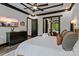 Elegant primary bedroom with a large bed, dark wood furniture, and a stylish, relaxing atmosphere at 231 Sunny Path Ln, Statesville, NC 28677