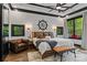 Nautical-themed primary bedroom with wood accents, a cozy seating area, and ample natural light at 231 Sunny Path Ln, Statesville, NC 28677