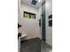 Sleek shower features pebble floor, accent tile, large rain shower head, bench, and windows at 231 Sunny Path Ln, Statesville, NC 28677