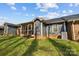The backyard of the house shows a screened porch and grassy lawn with blue siding at 234 Pointe Cir, Rock Hill, SC 29732