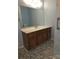 Bathroom featuring a stone-tile floor, wooden vanity, and glass-enclosed shower at 234 Pointe Cir, Rock Hill, SC 29732
