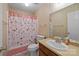Bathroom with decorative wallpaper and a shower with patterned curtain at 234 Pointe Cir, Rock Hill, SC 29732