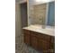 Bathroom featuring a stone-tile floor, wooden vanity, and glass-enclosed shower at 234 Pointe Cir, Rock Hill, SC 29732