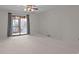 Large bedroom featuring a door to screened porch, neutral walls and carpet at 234 Pointe Cir, Rock Hill, SC 29732