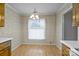 Cozy dining area with patterned wallpaper, wood floors, and a charming light fixture at 234 Pointe Cir, Rock Hill, SC 29732