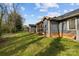 Exterior of homes featuring well-kept lawns and inviting screened-in porches at 234 Pointe Cir, Rock Hill, SC 29732