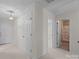 Hallway featuring doors, carpet flooring, and access to a bathroom at 234 Pointe Cir, Rock Hill, SC 29732