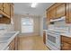 Bright kitchen with white appliances, ample cabinets, and open layout at 234 Pointe Cir, Rock Hill, SC 29732