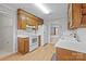 Functional kitchen with white appliances, wood cabinets, and plenty of counter space at 234 Pointe Cir, Rock Hill, SC 29732