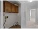 Functional laundry room with cabinets and connections for washer and dryer at 234 Pointe Cir, Rock Hill, SC 29732