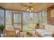 Relaxing sunroom with screened windows and comfortable seating at 234 Pointe Cir, Rock Hill, SC 29732