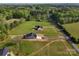 Aerial view of newly constructed homes in a rural community surrounded by lush greenery at 2355 Emanuel Church Rd, Rockwell, NC 28138