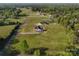 High aerial view of property with large green space, gravel drive, and lush natural surroundings at 2355 Emanuel Church Rd, Rockwell, NC 28138