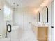 Bright bathroom featuring double vanity, a freestanding tub and glass shower with marble-look tile at 2355 Emanuel Church Rd, Rockwell, NC 28138