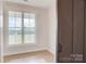 Bright room featuring a large window and wood-look flooring, offering ample natural light and a modern touch at 2355 Emanuel Church Rd, Rockwell, NC 28138