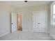Neutral bedroom with carpet and a closet next to a window and a door into an adjoining room at 2355 Emanuel Church Rd, Rockwell, NC 28138