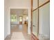 Front door leads into the home, showcasing the living spaces, the dining room, and the kitchen at 2355 Emanuel Church Rd, Rockwell, NC 28138