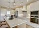 A modern, bright kitchen featuring stainless steel appliances and a large center island at 2355 Emanuel Church Rd, Rockwell, NC 28138