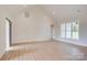 Bright living room with a vaulted ceiling and a sliding barn door leading to another room at 2355 Emanuel Church Rd, Rockwell, NC 28138