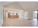 Open concept living space with modern kitchen appliances and a vaulted ceiling at 2355 Emanuel Church Rd, Rockwell, NC 28138