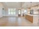 Spacious living room with an open floor plan to the kitchen, featuring stainless steel appliances at 2355 Emanuel Church Rd, Rockwell, NC 28138