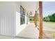 Long porch with wood beams that highlights natural surroundings with a gravel area at the side at 2355 Emanuel Church Rd, Rockwell, NC 28138