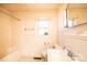 Traditional bathroom with a window, bathtub, toilet, and sink at 2375 E Nc 10 Hwy None, Conover, NC 28613
