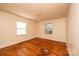 Cozy bedroom featuring hardwood floors and a window at 2375 E Nc 10 Hwy None, Conover, NC 28613