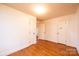 A bright, empty bedroom with hardwood floors and two closets at 2375 E Nc 10 Hwy None, Conover, NC 28613