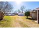View of a detached garage with a double door, set on a grassy lot at 2375 E Nc 10 Hwy None, Conover, NC 28613