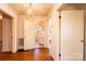 Hallway with hardwood floors, doors leading to rooms and a chandelier at 2375 E Nc 10 Hwy None, Conover, NC 28613