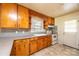 Traditional kitchen with light wood cabinetry, tile floors, and a double basin sink at 2375 E Nc 10 Hwy None, Conover, NC 28613