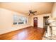 Light-filled living room featuring hardwood floors, a stone fireplace, and a large window at 2375 E Nc 10 Hwy None, Conover, NC 28613