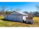 Exterior view of an outbuilding with weathered white paint and metal roof at 2375 E Nc 10 Hwy None, Conover, NC 28613