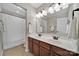 This bathroom features a double sink vanity with white countertops at 2517 Trading Ford Dr, Waxhaw, NC 28173